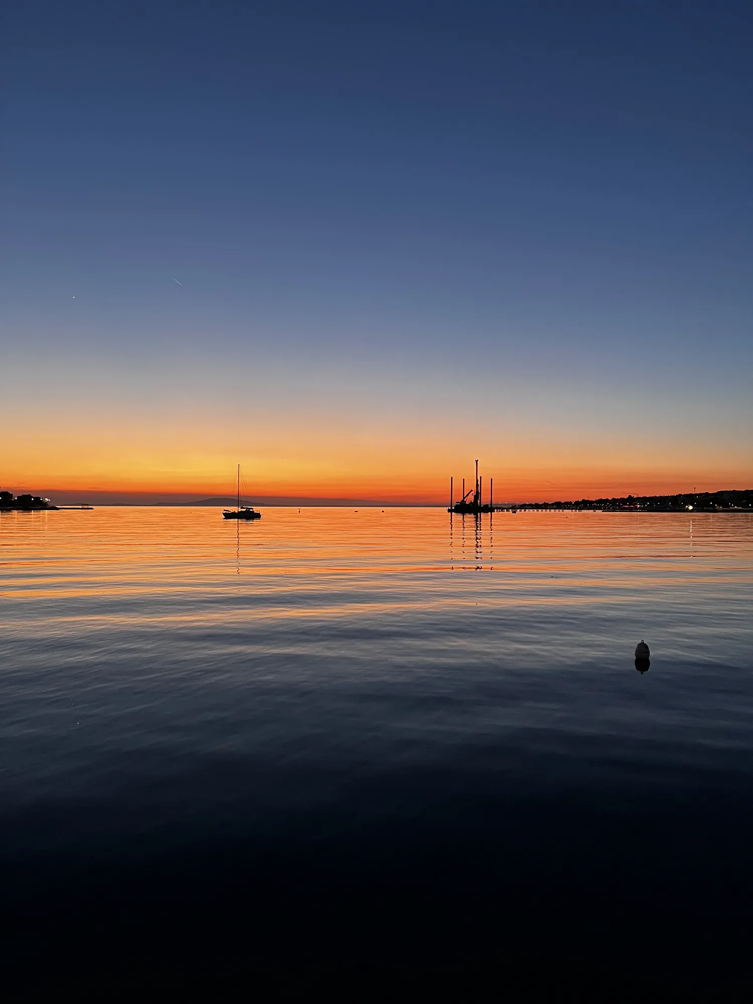 Sunset over the Adriatic with sailing boats