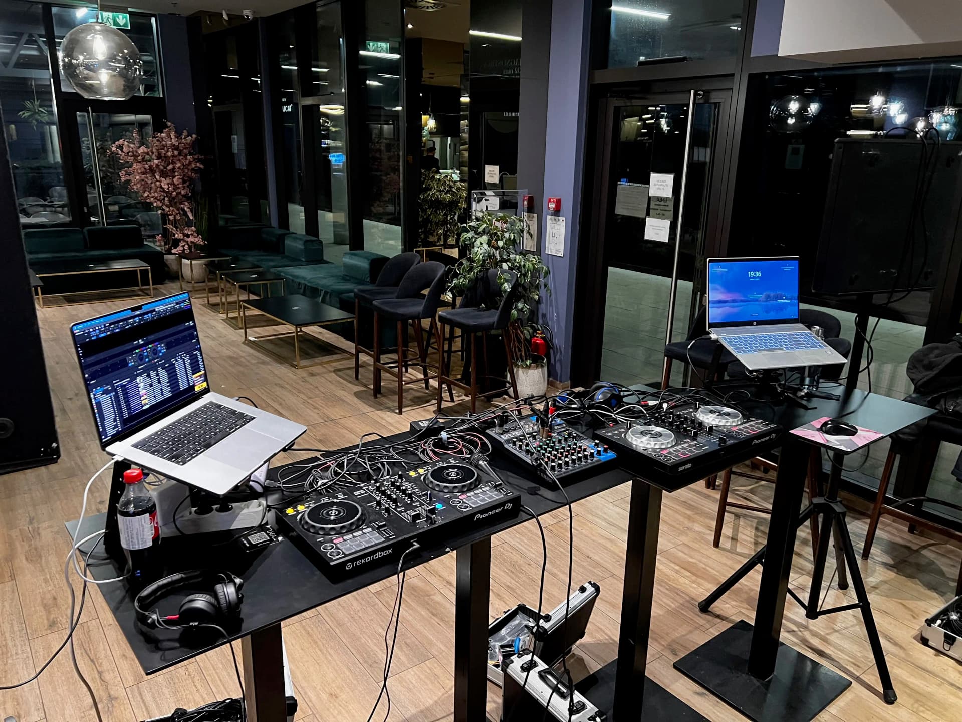 Linea Bar DJ booth before the gig — two laptops, two decks, mixers, headphones